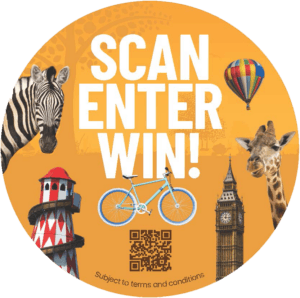 The image features a vibrant orange background with the text "SCAN ENTER WIN!" prominently displayed. It includes a variety of whimsical illustrations: a zebra, a giraffe, Big Ben, a hot air balloon, a lighthouse, and a bicycle, all set against a faint giraffe-skin pattern. A QR code is centrally placed for easy scanning, and the phrase "Subject to terms and conditions" is noted at the bottom, indicating a promotional contest. The design suggests a fun and adventurous theme, likely appealing to a broad audience.